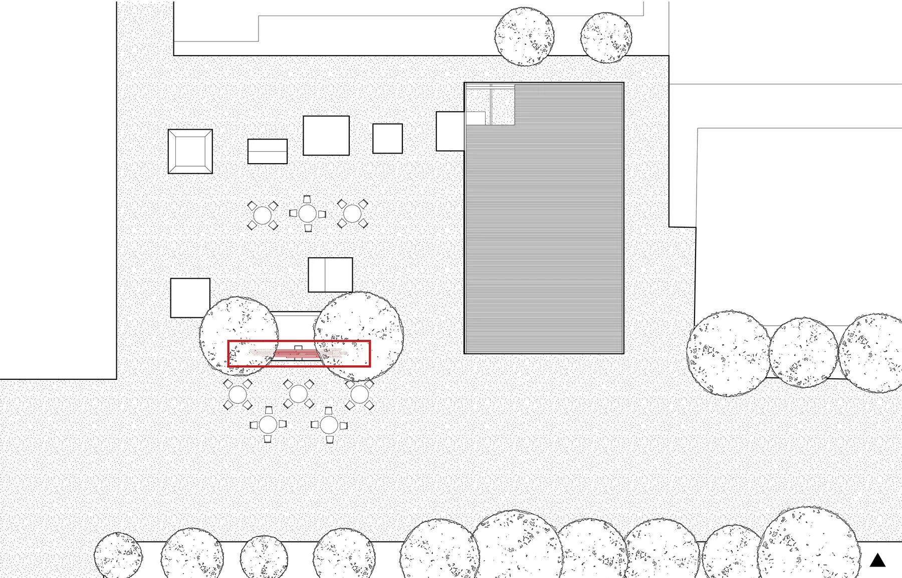 Site plan: the sculpture, outlined in red, between two trees among café tables on the campus