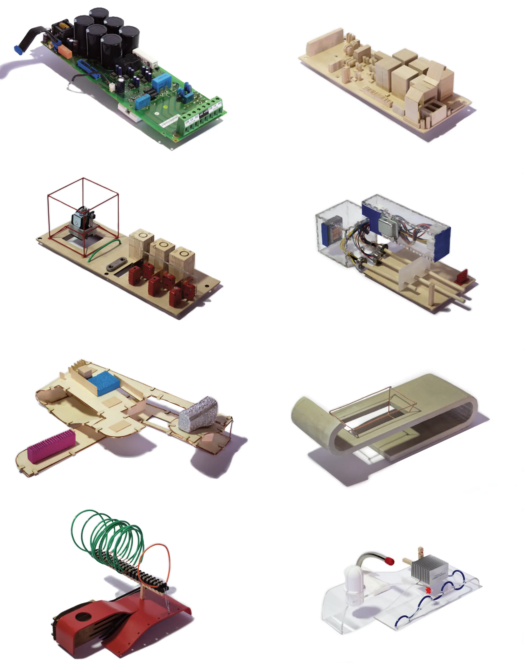 The circuit board, a basswood replica of it, and six models made from it